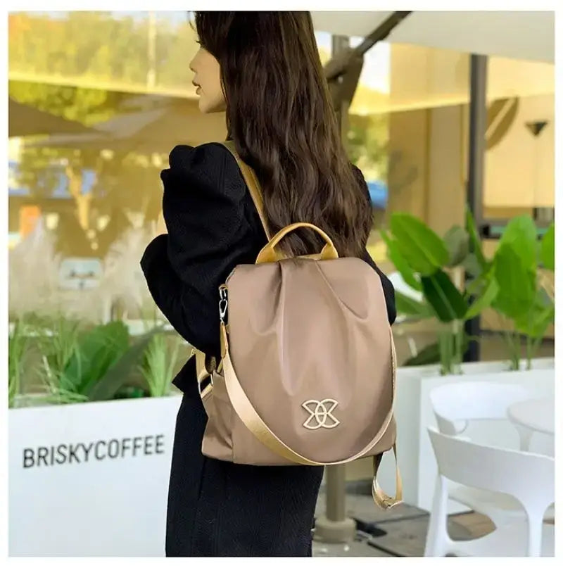 Stylish backpack in taupe colored leather for ladies